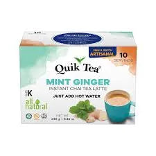 Box of Quik Tea Mint Ginger instant chai tea latte with a blue mug on a white background