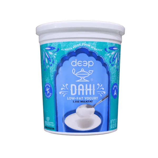Container of deep Dahi low-fat yogurt on a white background