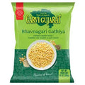 Packaged food product with a green label and white bowl of noodles on a red background
