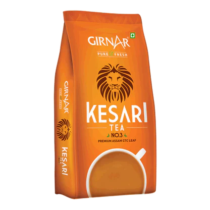 Orange package of Girnar Kesari Tea with a lion logo on a white background