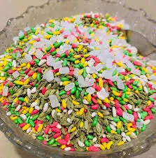 Colorful small stones or beads on a concrete surface