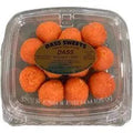 Packaged orange spherical treats with a label on a clear background